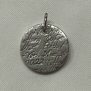 Tiffany and co “notes” round pendant Authentic